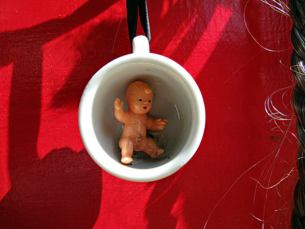 Odd Surreal details abound - Babe in Cup